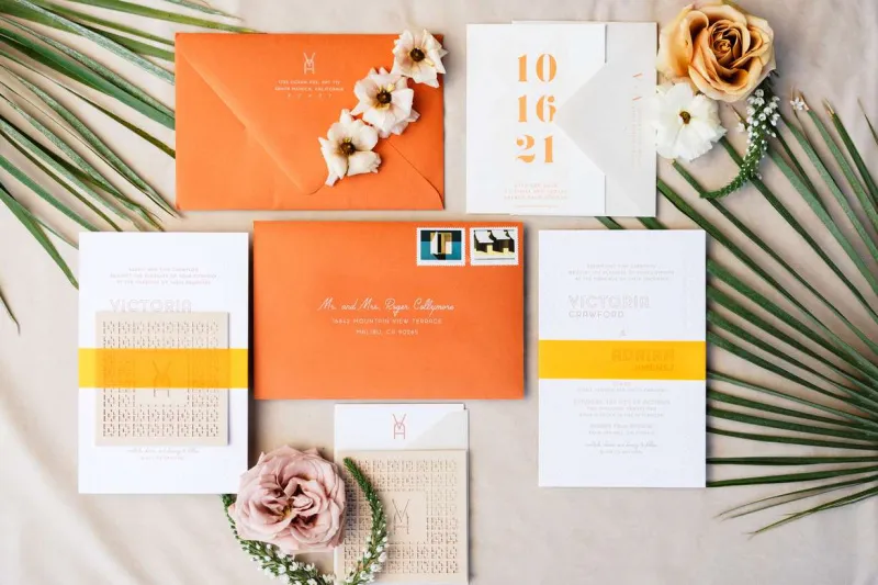   Victoria et Adrien's colorful stationery suite in orange and yellow tones