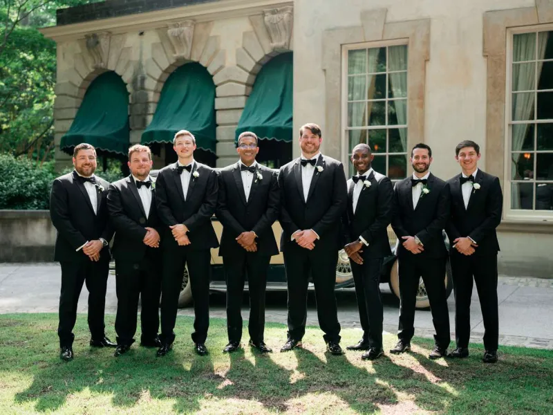   דונובן's groomsmen in black tuxedos