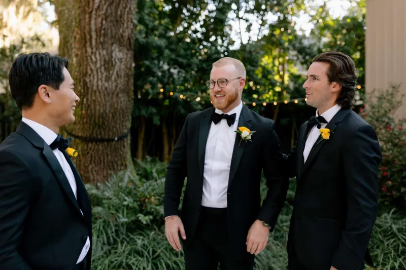  Connor's groomsmen in black tuxedos
