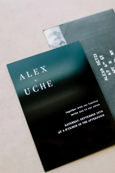   Alex e Uche's dark invitations with white font